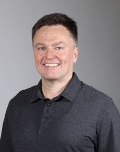 Headshot of Alex Compton